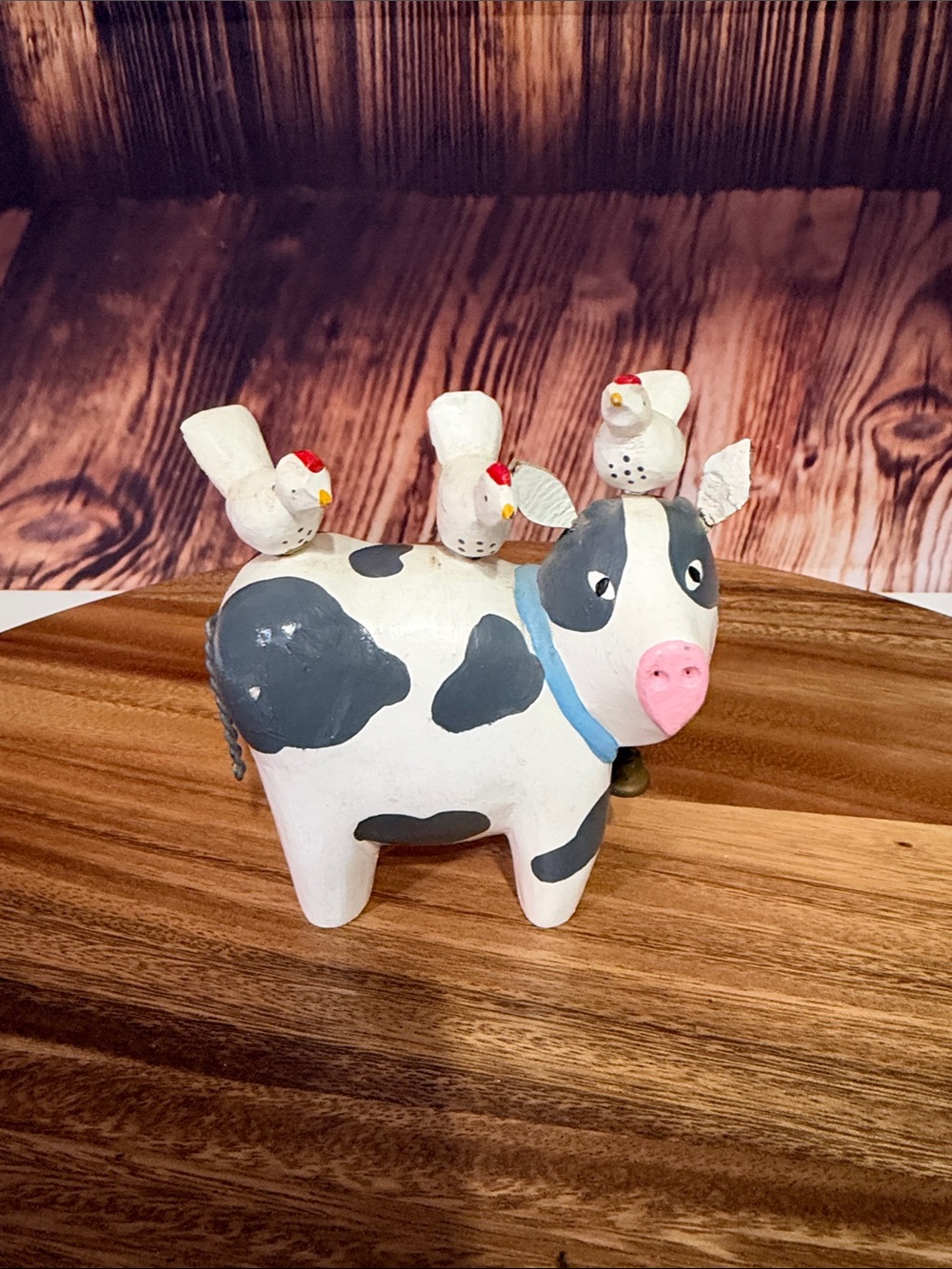 Whimsical White and Gray Cow Figurine with Pink Nose and Bird Accents